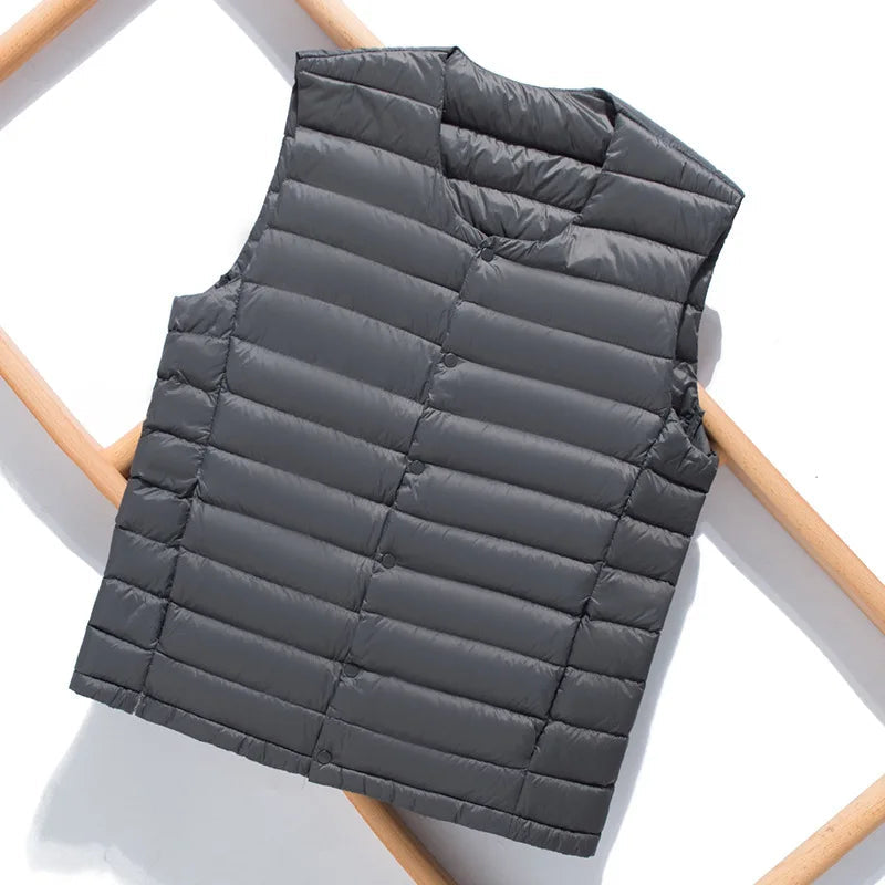 Size chart graphic showing measurements for the men's down vest.
