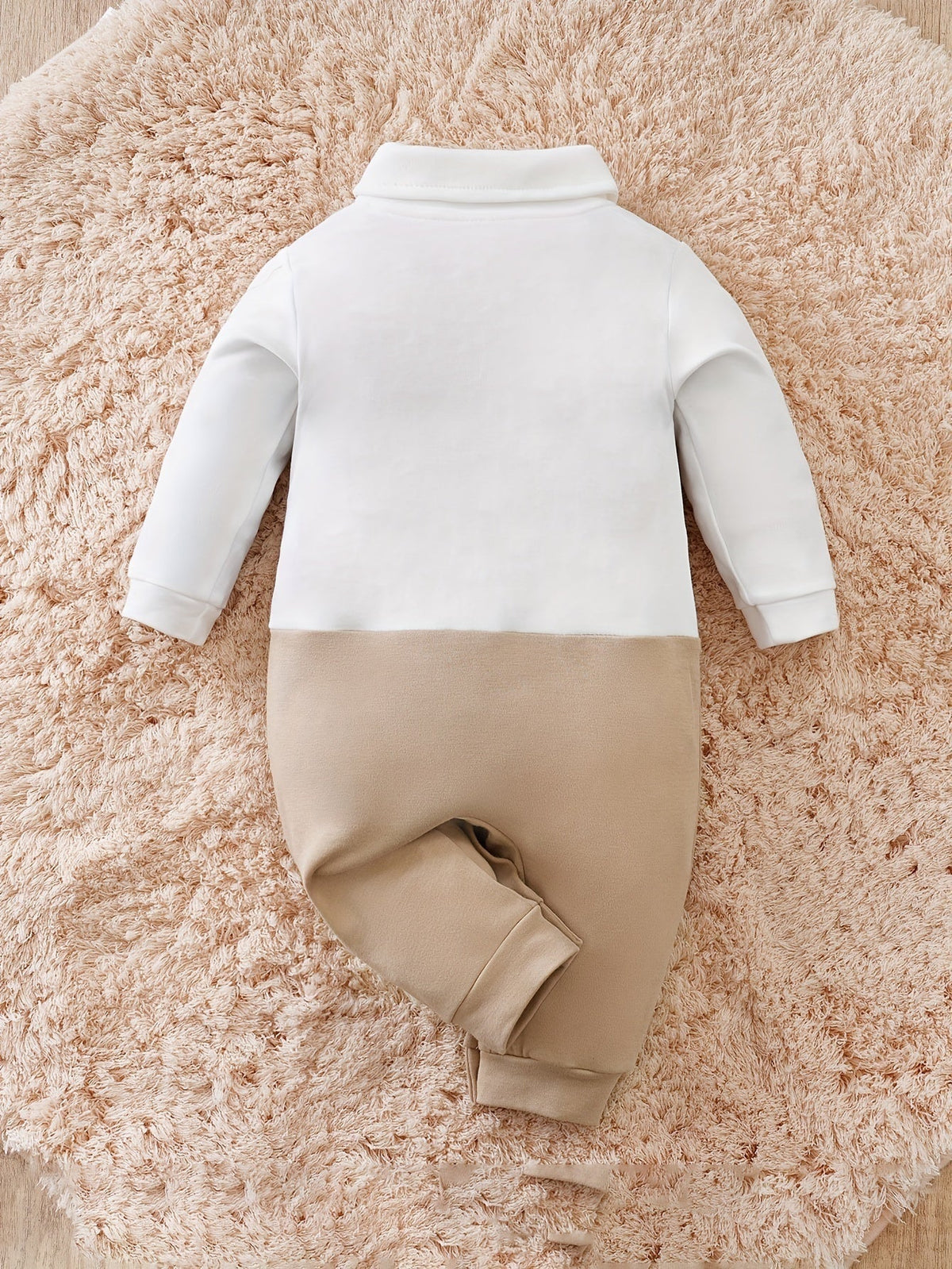 Baby tuxedo romper with snaps from top to bottom