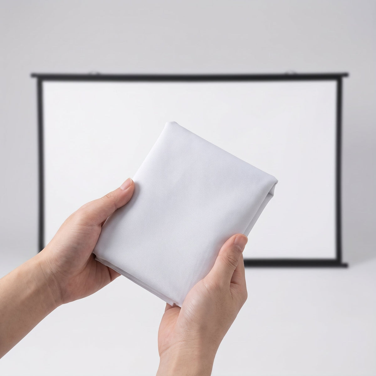 Foldable 60 inch white projector screen hanging in a backyard for an outdoor movie night