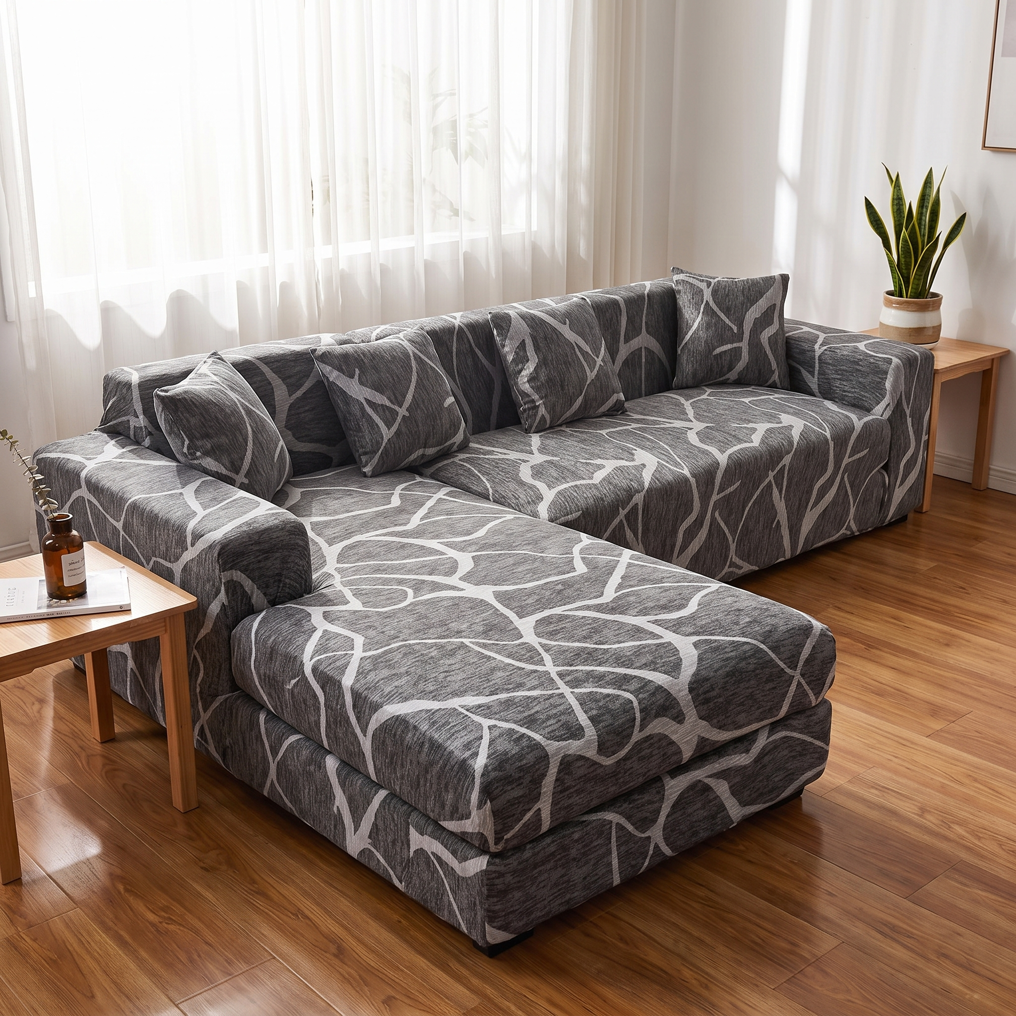 Stretch Sectional Couch Cover – Grey Branch Print shown in a styled home interior | Brivenzo