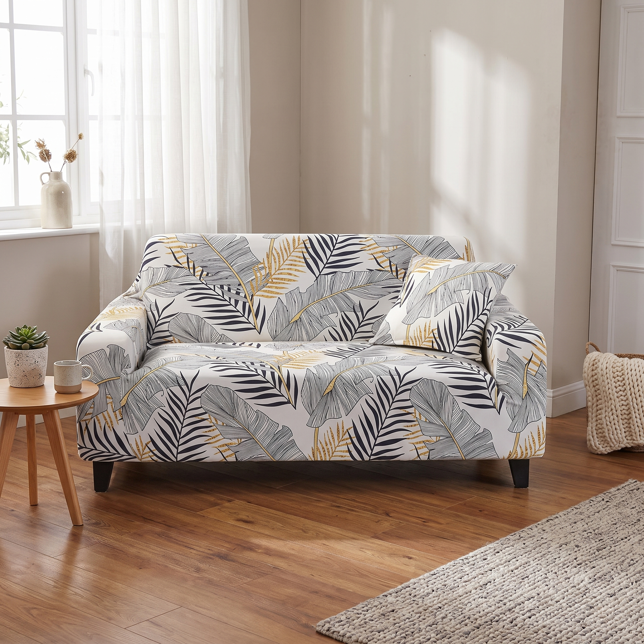 Stretch Sofa Slipcover – Black Gold Palm Leaf Print shown in a styled home interior | Brivenzo