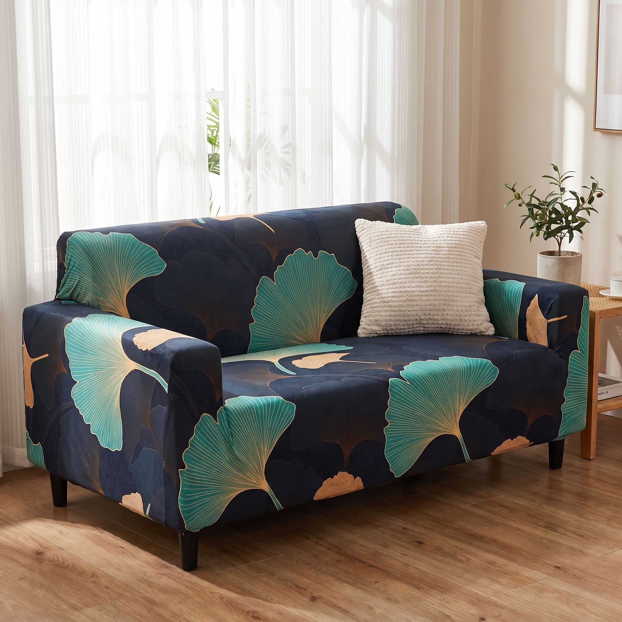Stretch Sofa Slipcover – Black Teal Gold Ginkgo Leaf Print shown in a styled home interior | Brivenzo