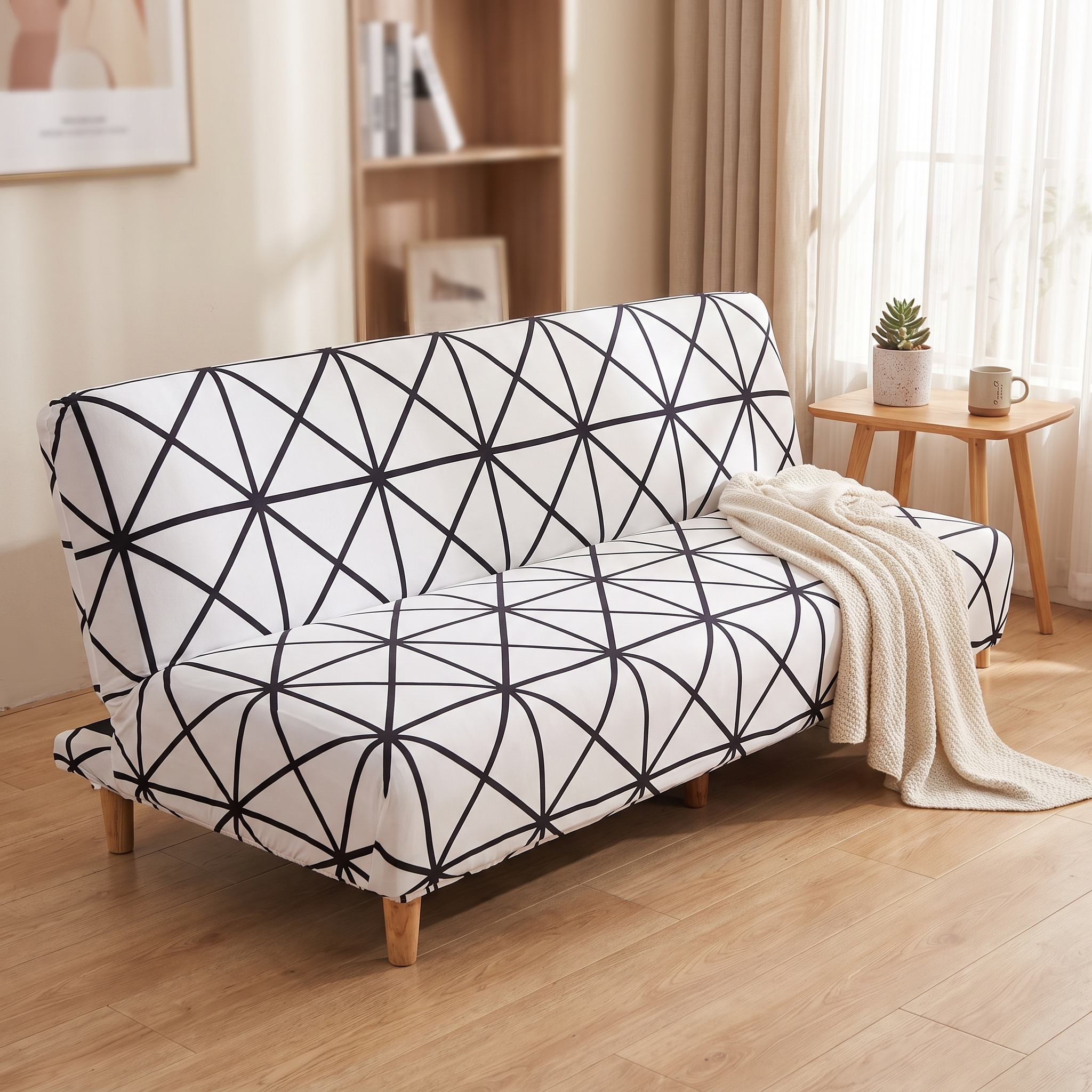 Stretch Sofa Slipcover – White Black Geometric Crystal Print Sofa Bed shown in a styled home interior | Brivenzo