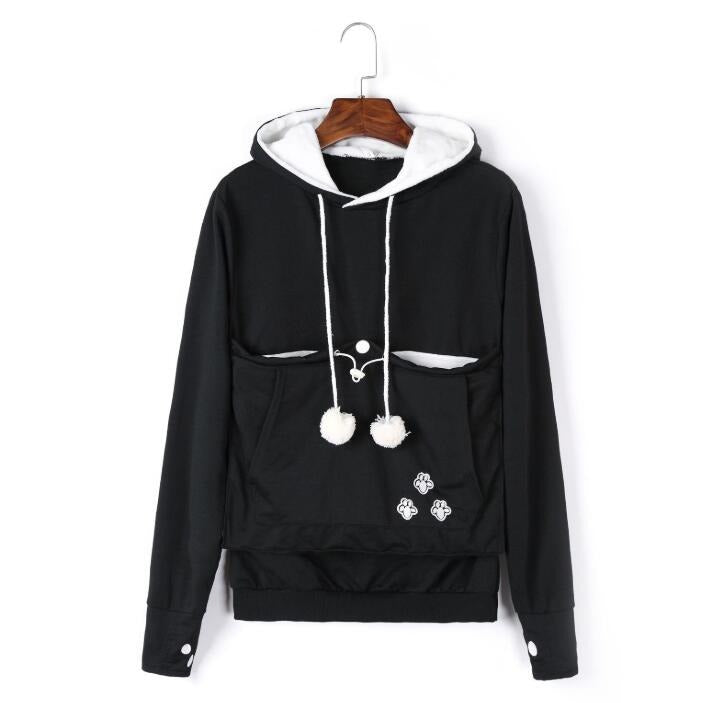 Cat napping in the front pouch of a soft hoodie