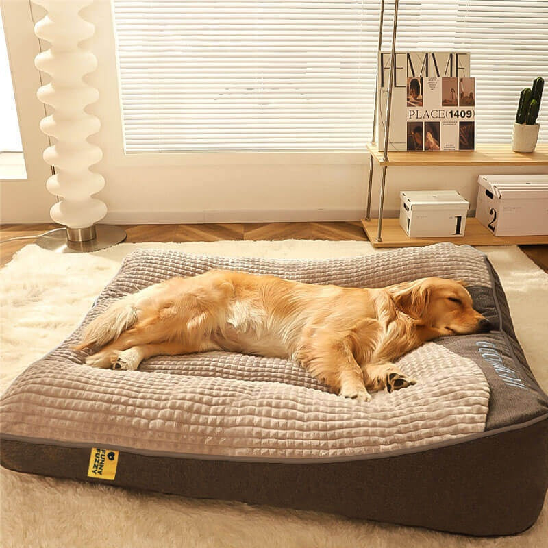 Dog bed with raised head pillow in brown and gray