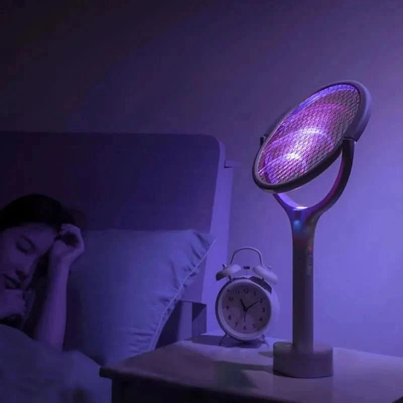 Electric bug zapper racket with rotating head reaching toward the ceiling