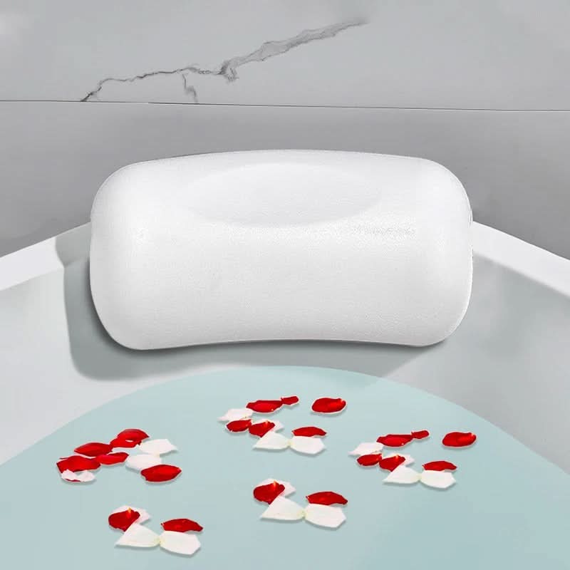 Person relaxing in the tub with head resting on the bath pillow