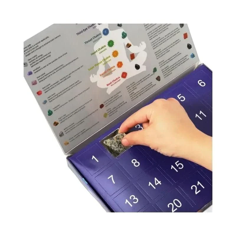 Child looking at a crystal from the advent calendar