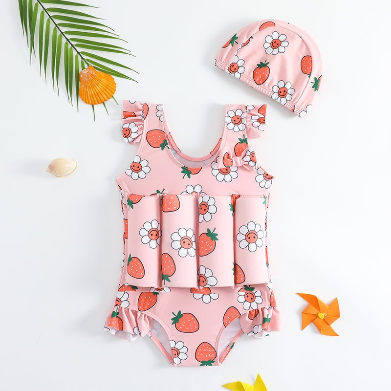 Pink girls' float swimsuit with strawberry and flower print and matching cap