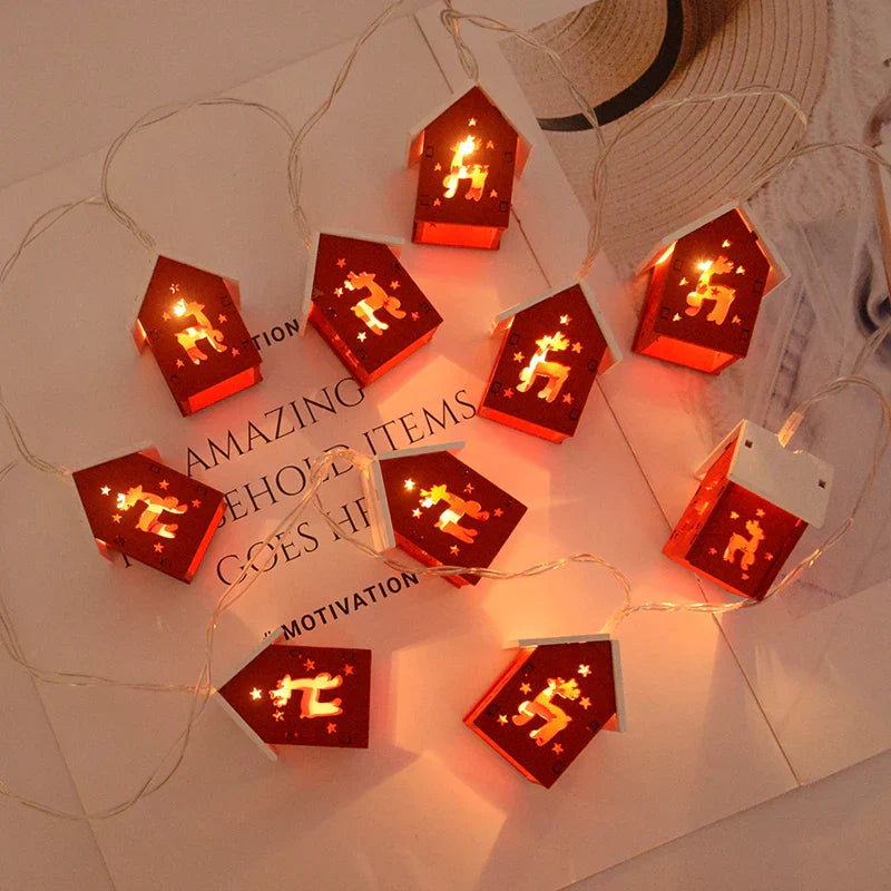 LED string lights with little glowing houses on a windowsill
