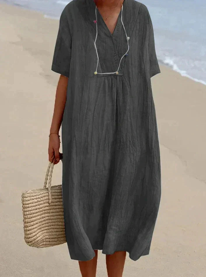 Woman wearing a lightweight A line summer dress with V neck