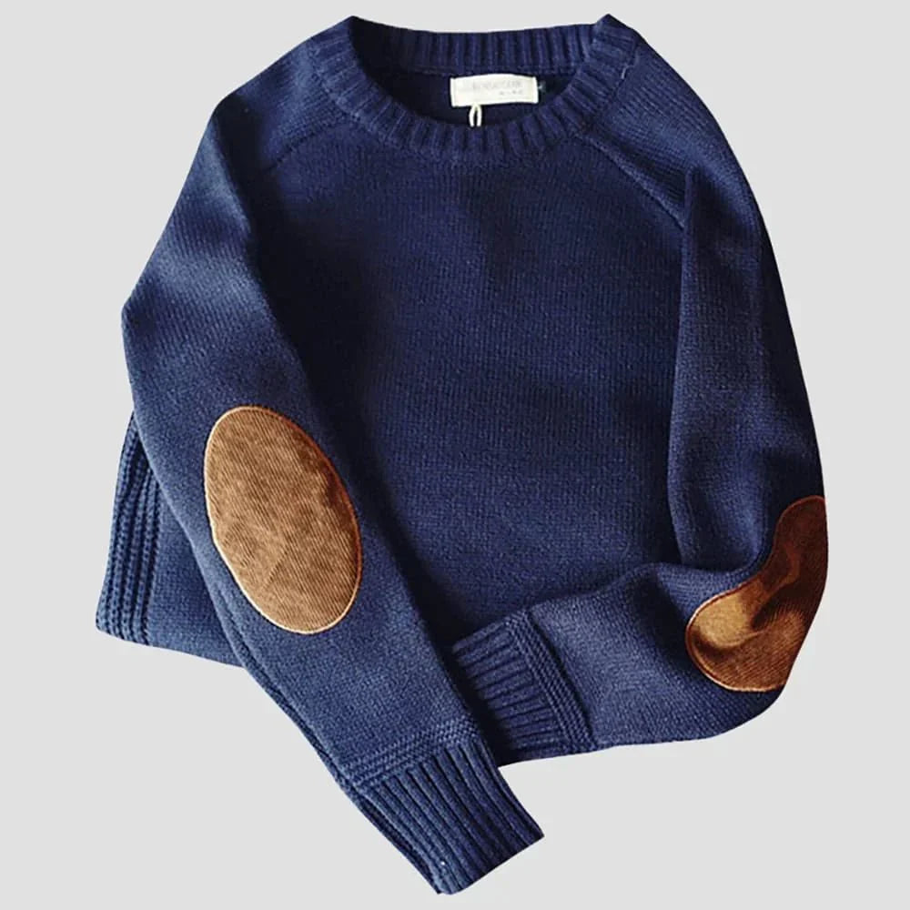 Close-up of the elbow patch and raglan sleeve on a men's knit sweater