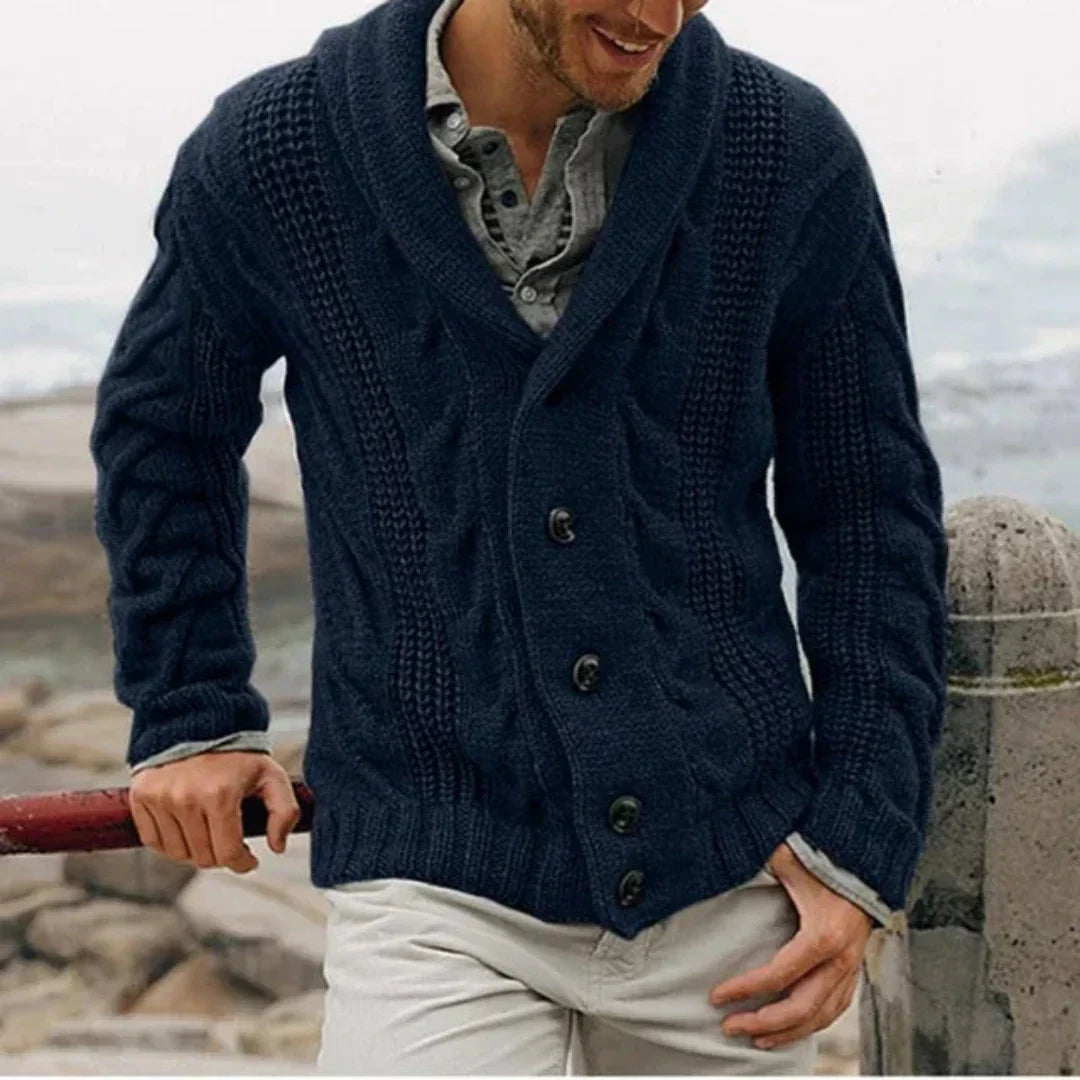 Man wearing a cable knit cardigan with a shawl collar