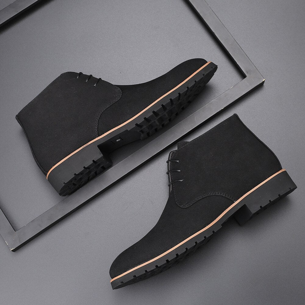Pair of men's slip on leather ankle boots in brown