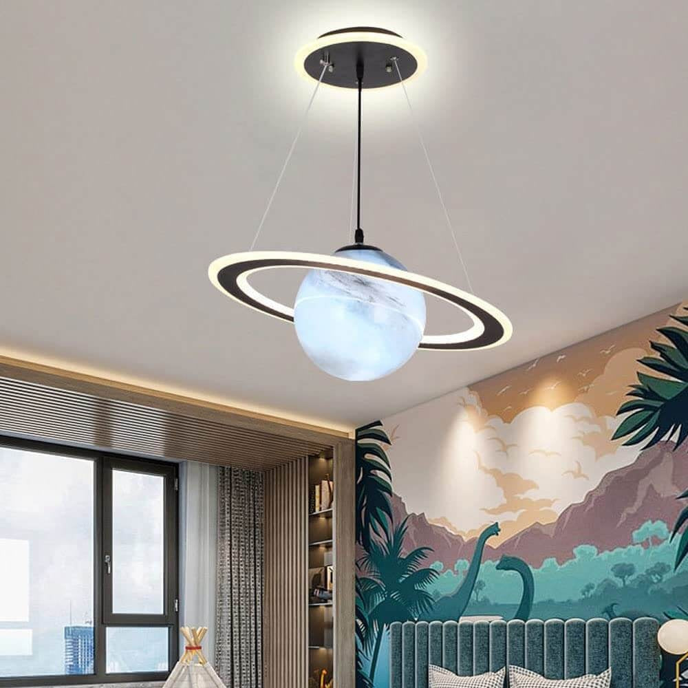 Orange Saturn pendant light with a small astronaut figure on the ring