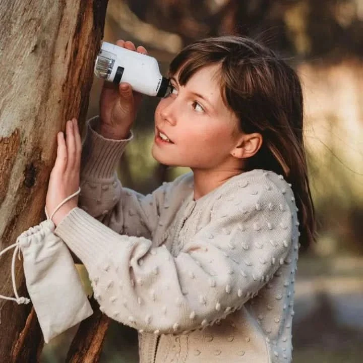 Pocket microscope with LED light and a set of prepared slides