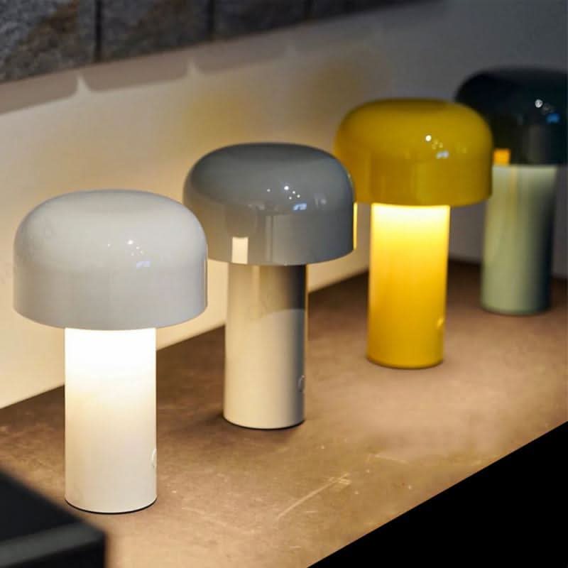 Portable bedside lamp glowing warmly on a nightstand