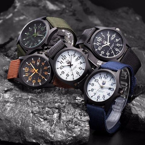Shockproof outdoor watch with backlit dial on a wrist