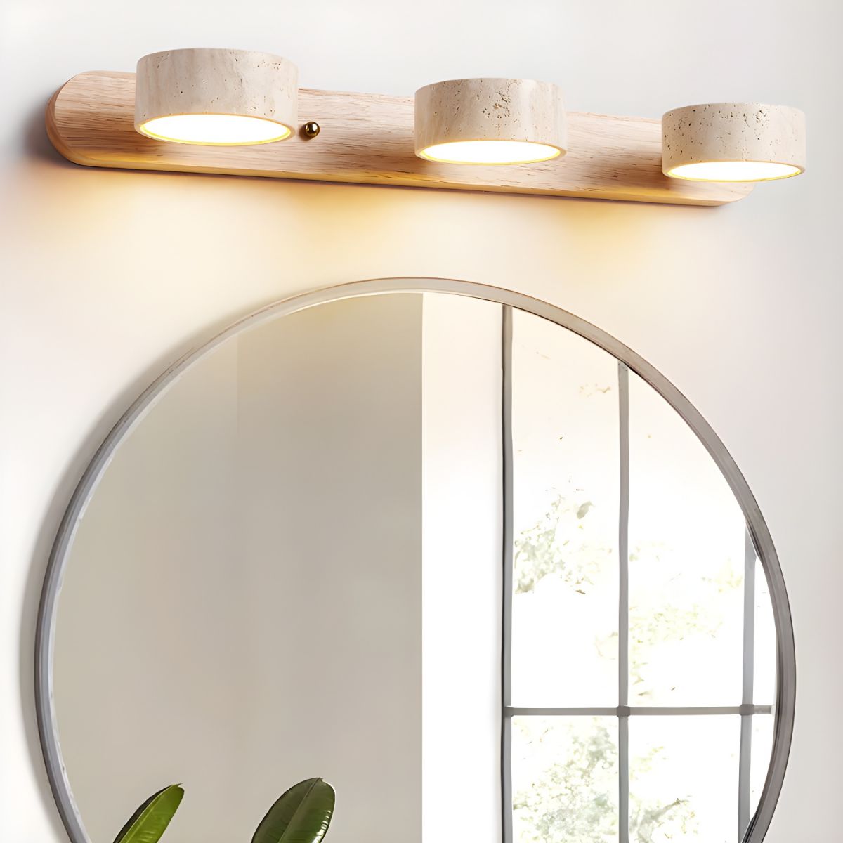 Travertine and wood LED wall sconce casting light up and down a wall