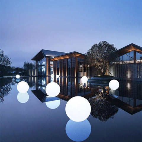 Waterproof LED ball lights glowing in different colors on a patio