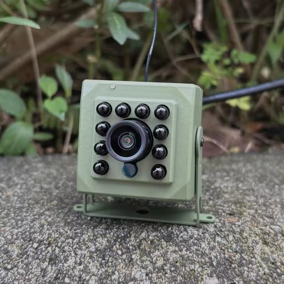 Metal WiFi security camera mounted on an exterior wall