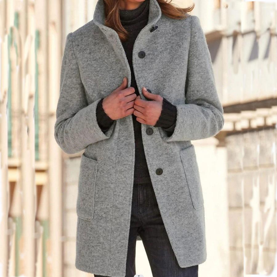 Woman wearing a classic wool coat with retro buttons