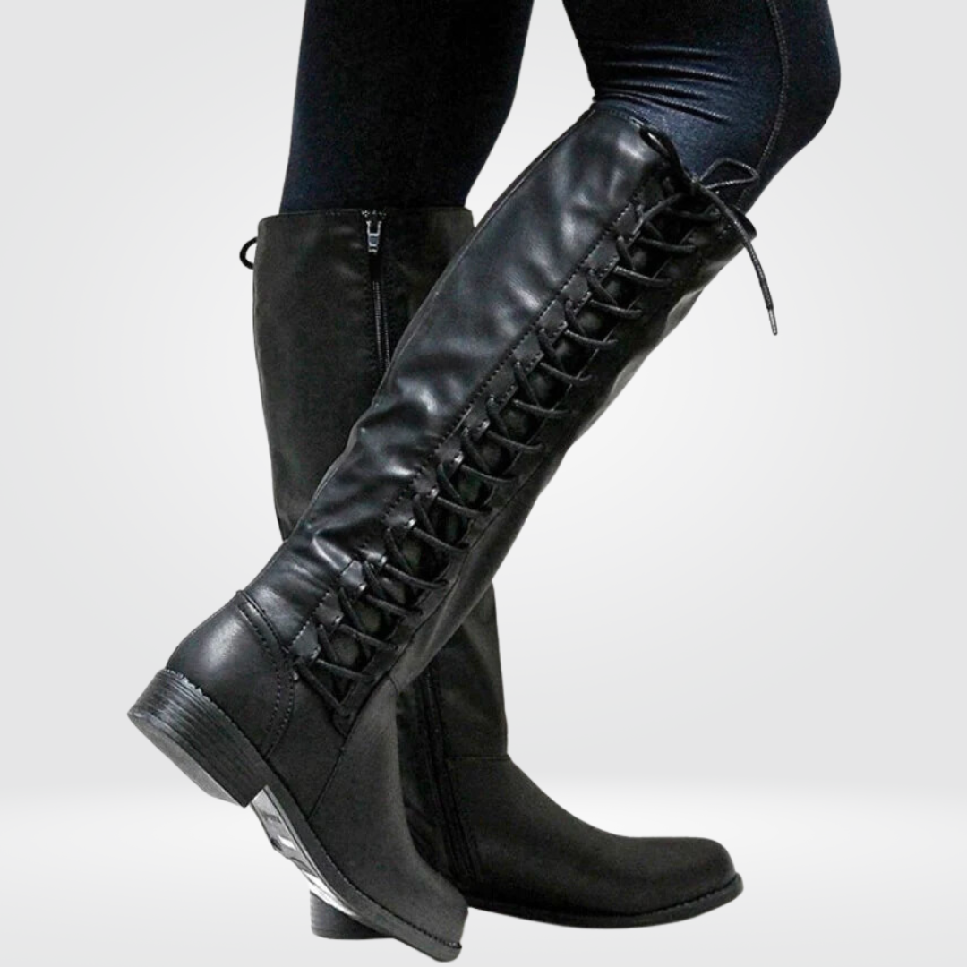 Woman wearing lined knee high boots with a low block heel