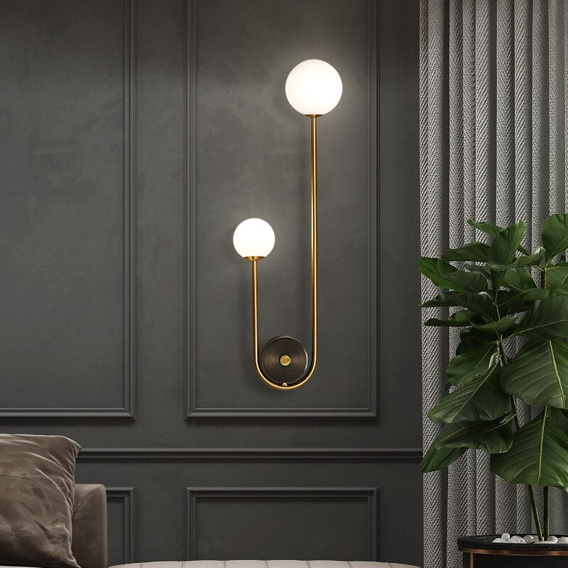 Gold Wall Sconce with Frosted Glass Globe