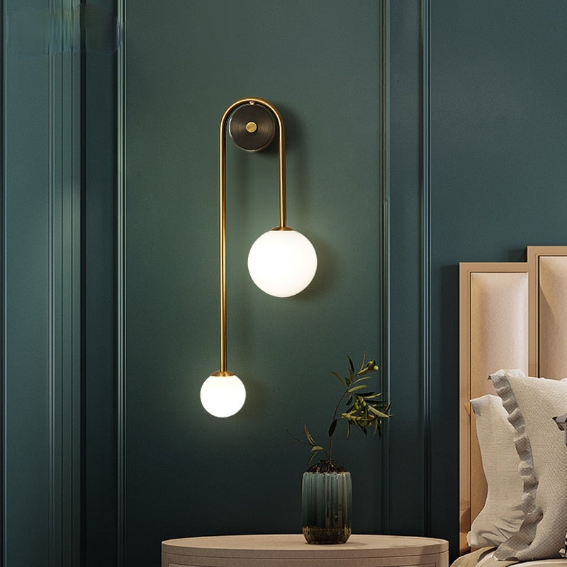 Gold Wall Sconce with Frosted Glass Globe