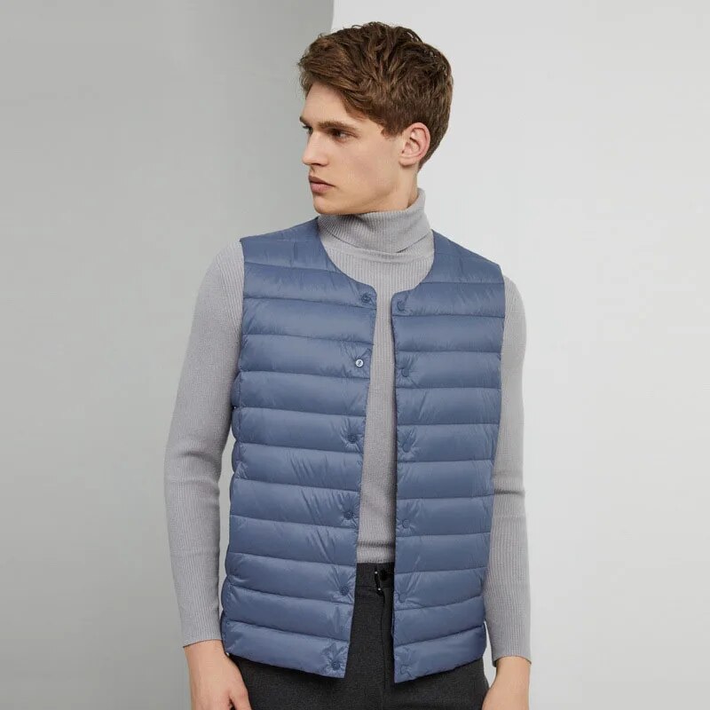 Detailed view of the stitching and duck down filling of the men's down vest.