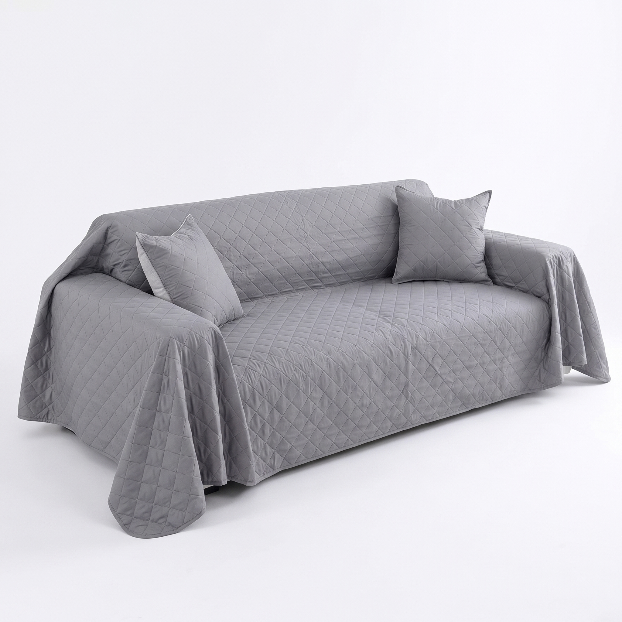 Grey waterproof quilted sofa cover, studio product photo