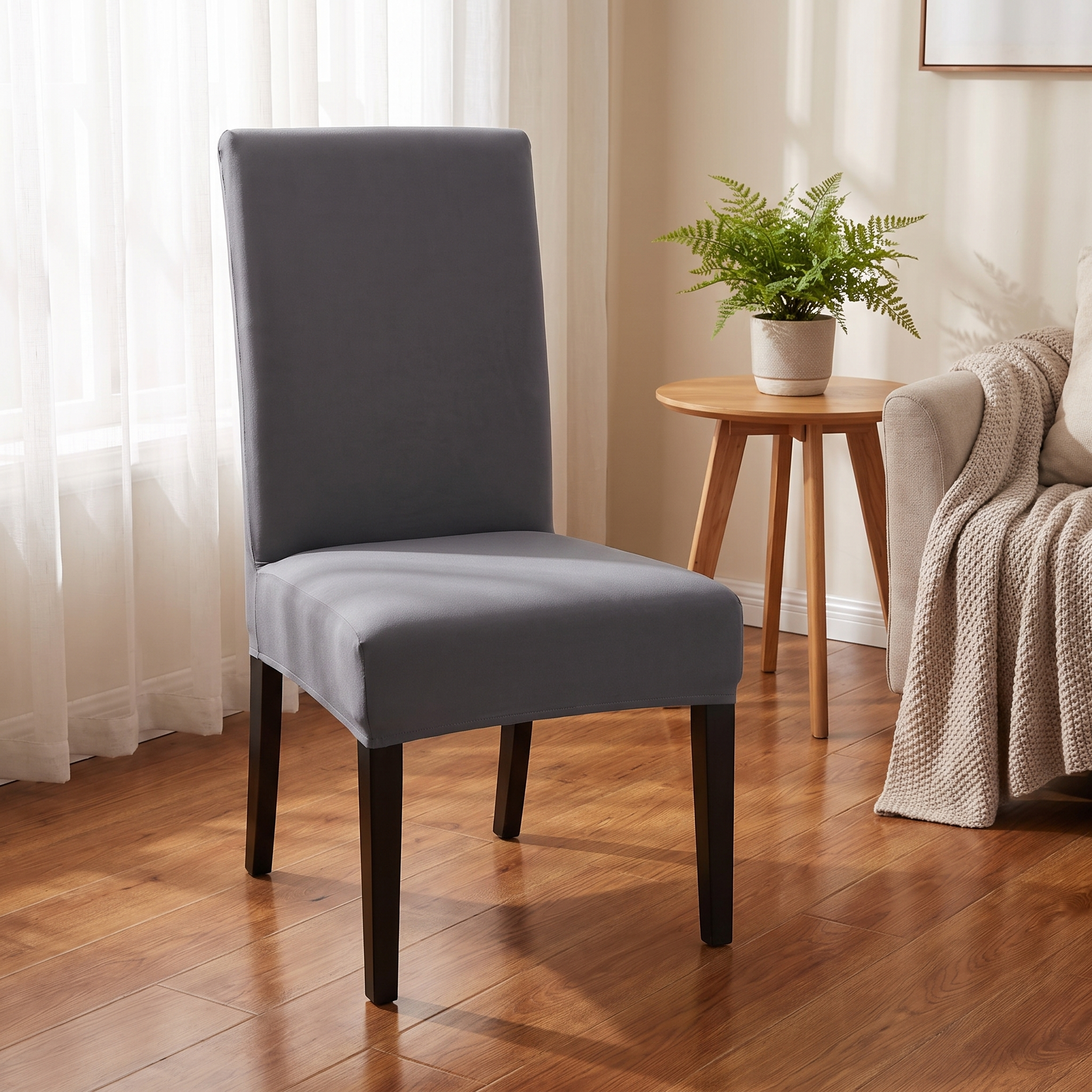 Grey stretch dining chair cover in living room