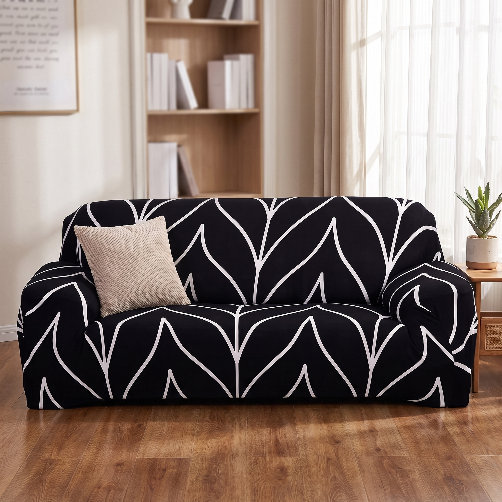Stretch Sofa Slipcover – Black & White Leaf Print shown in a styled home interior | Brivenzo