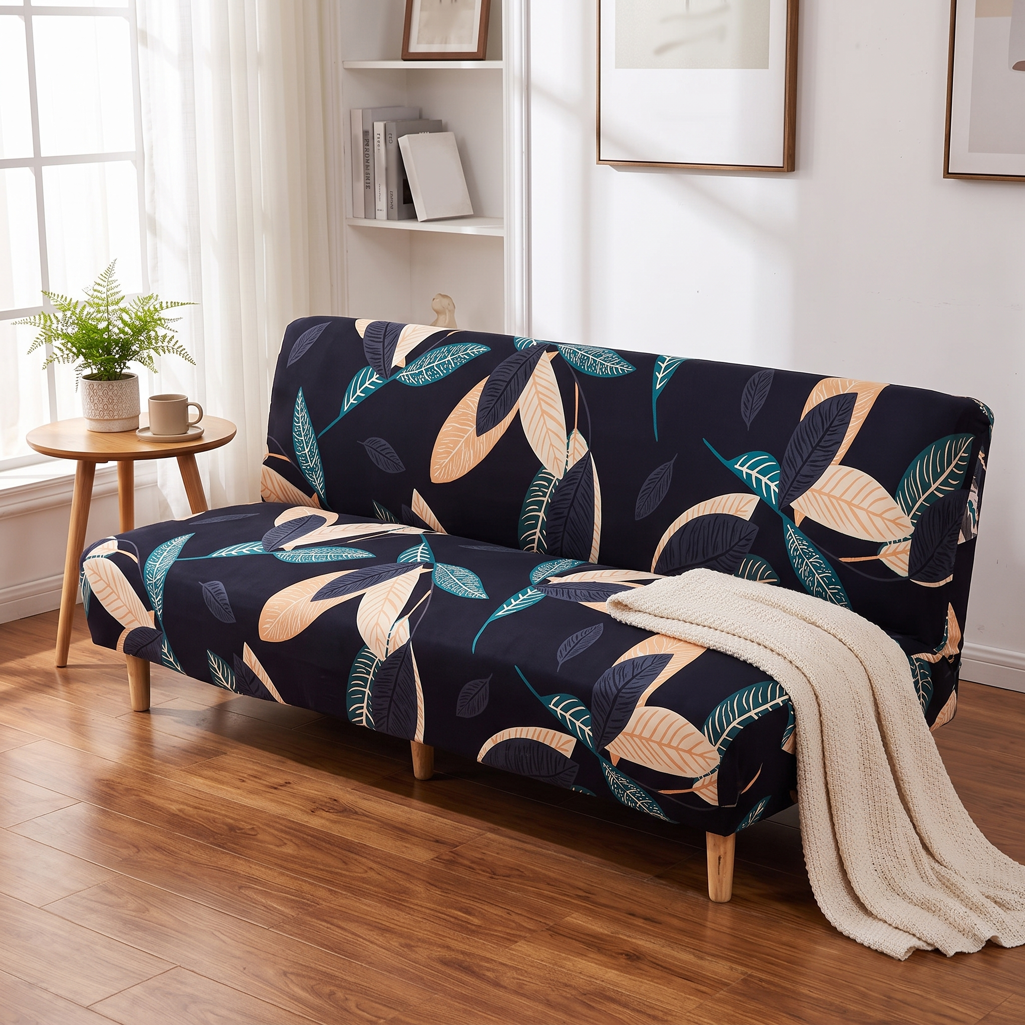 Stretch Sofa Slipcover – Black Teal Leaf Print Sofa Bed shown in a styled home interior | Brivenzo
