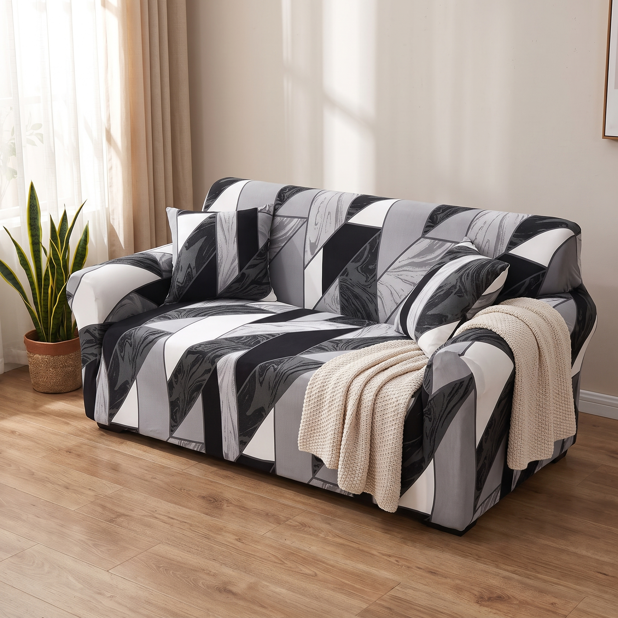 Stretch Sofa Slipcover – Black White Grey Geometric Print shown in a styled home interior | Brivenzo