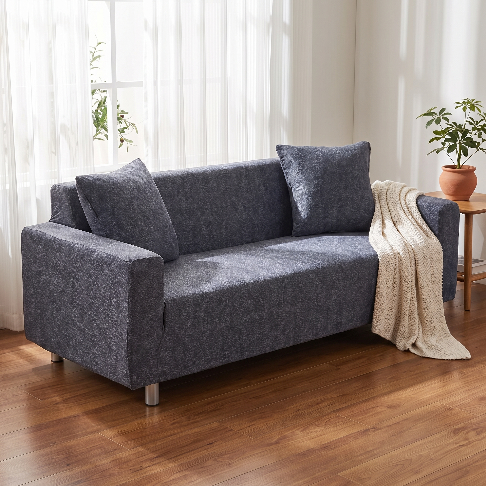 Stretch Sofa Slipcover – Charcoal Grey shown in a styled home interior | Brivenzo