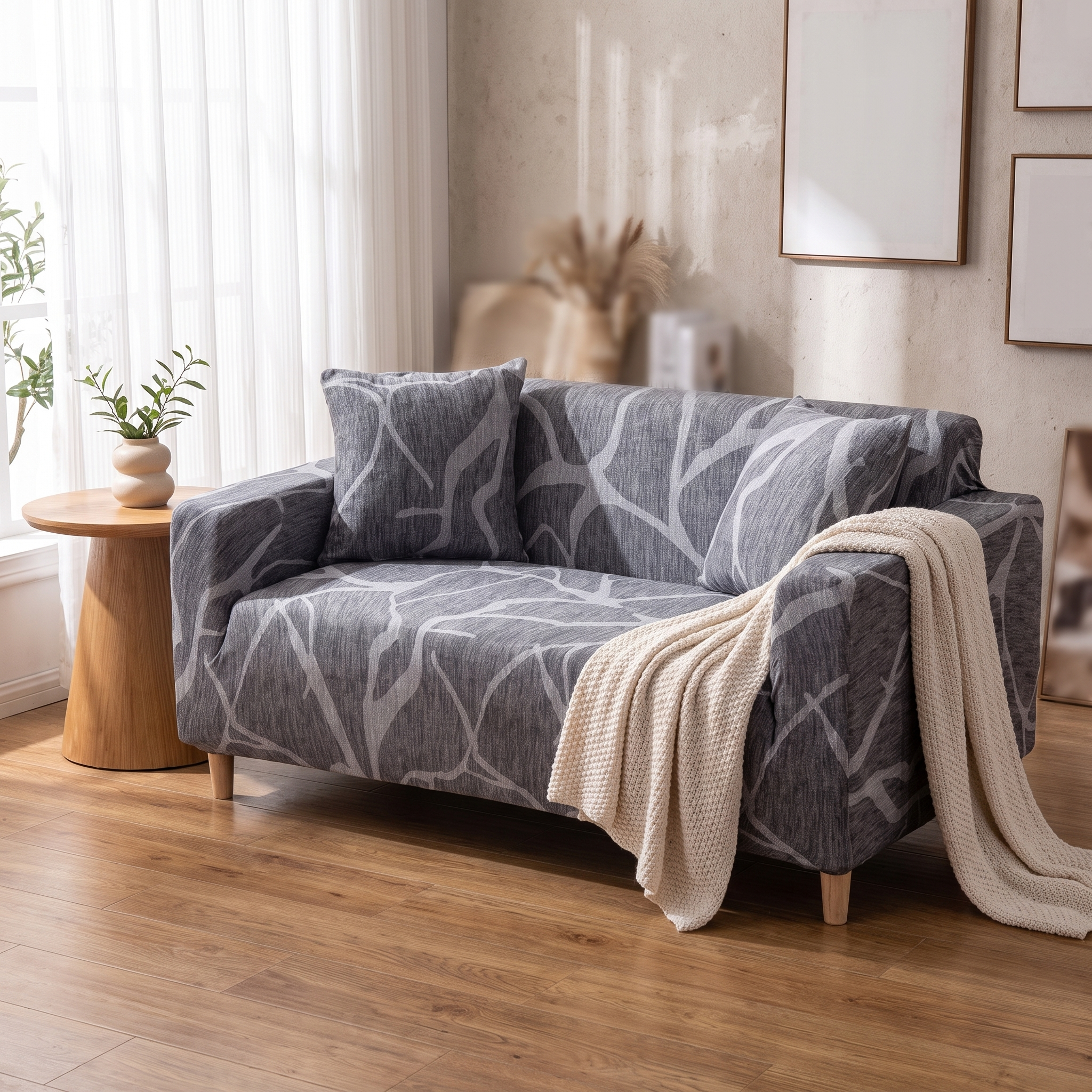 Stretch Sofa Slipcover – Grey Abstract Branch Print shown in a styled home interior | Brivenzo