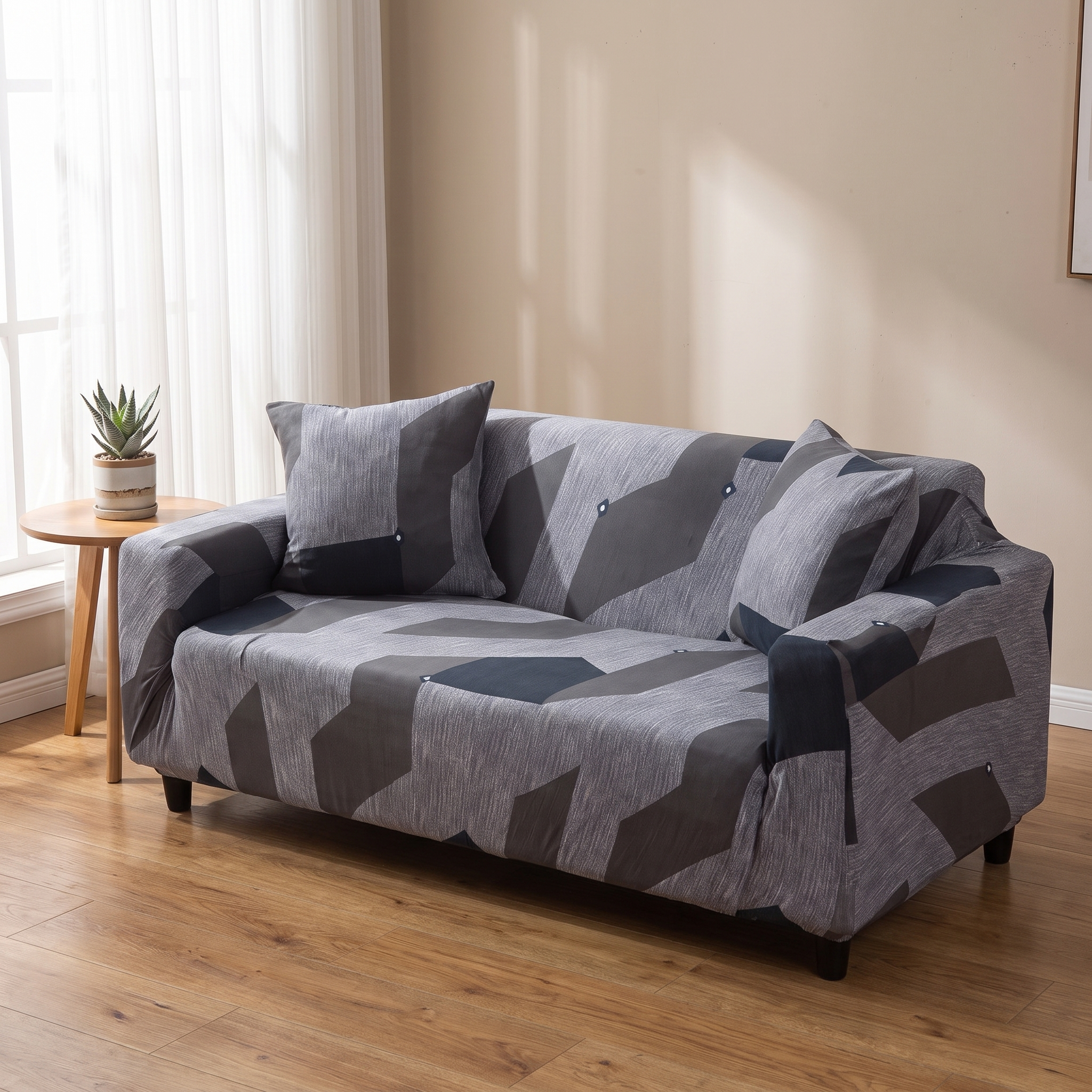 Stretch Sofa Slipcover – Grey & Blue Geometric Pattern shown in a styled home interior | Brivenzo