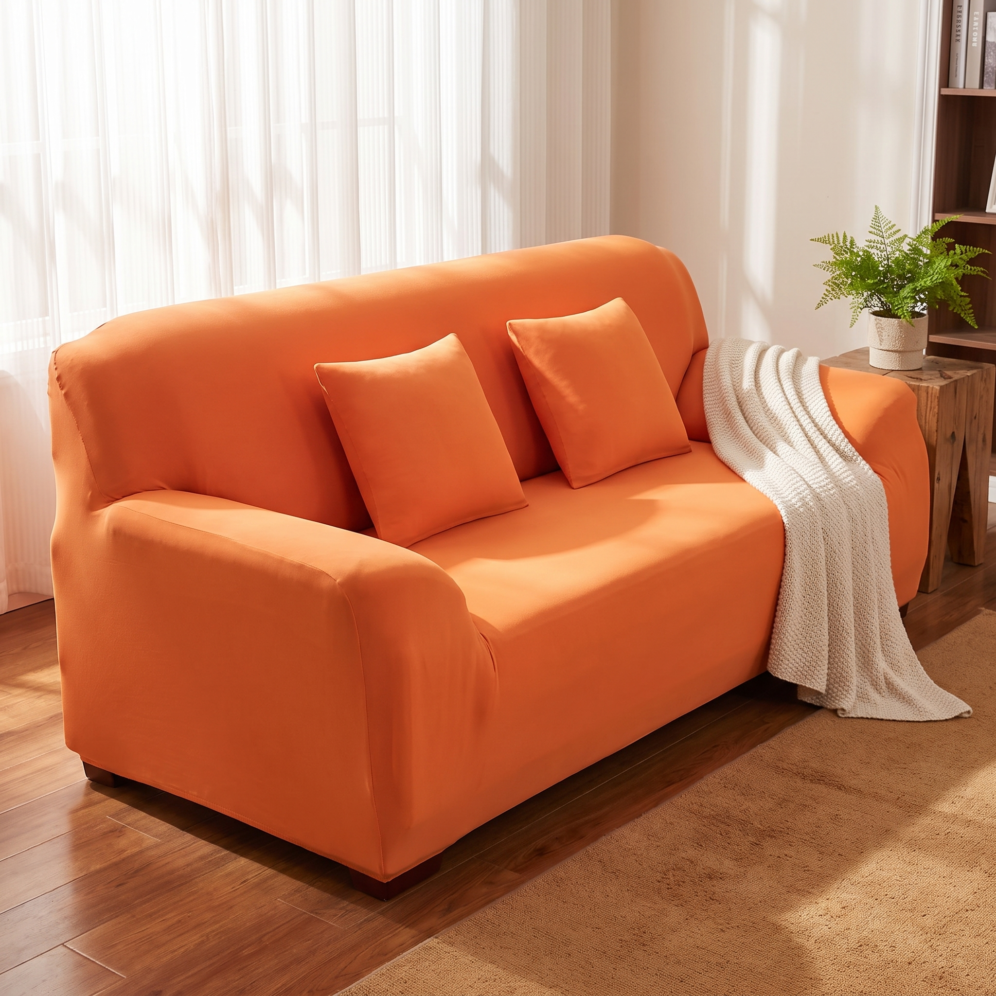 Orange stretch sofa slipcover in a cozy living room