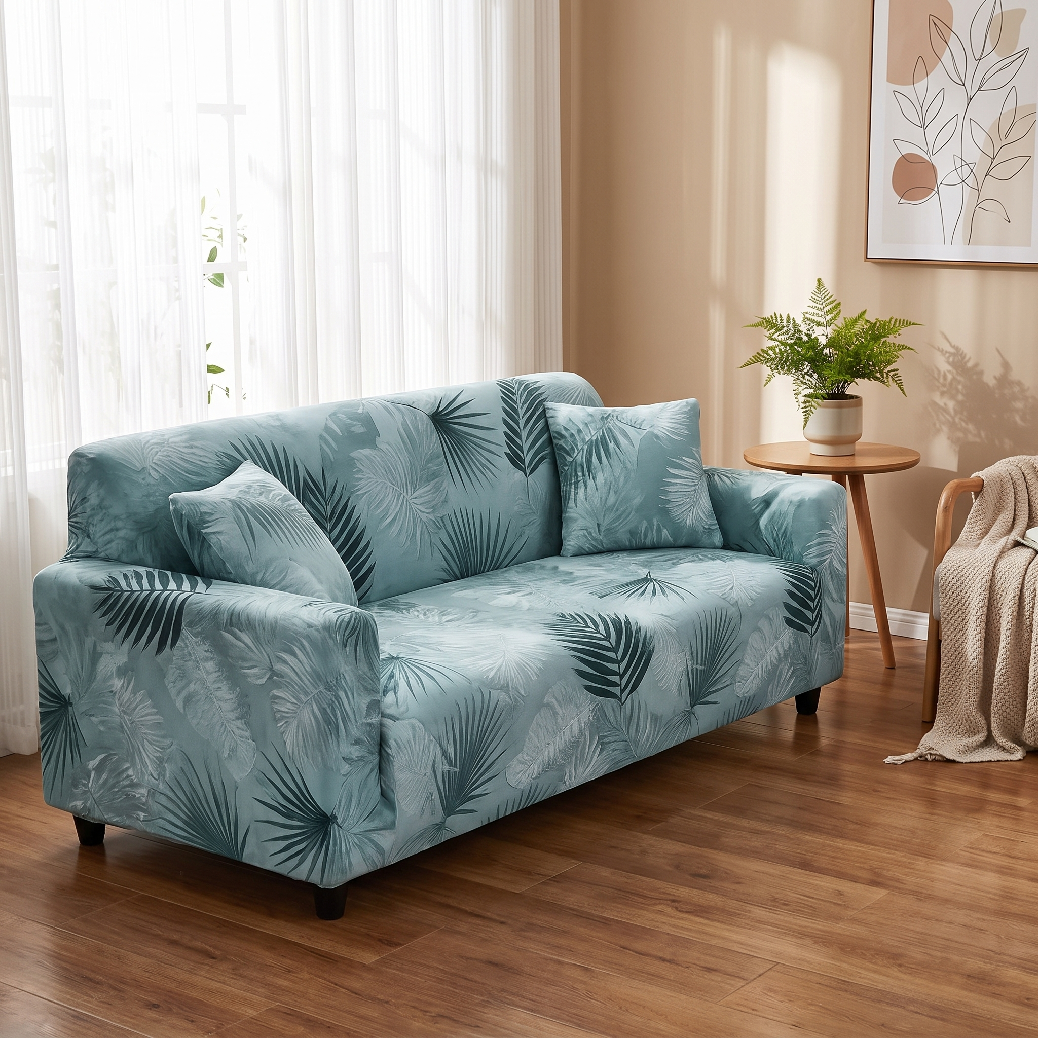Sage green palm leaf print stretch sofa slipcover in a warm living room