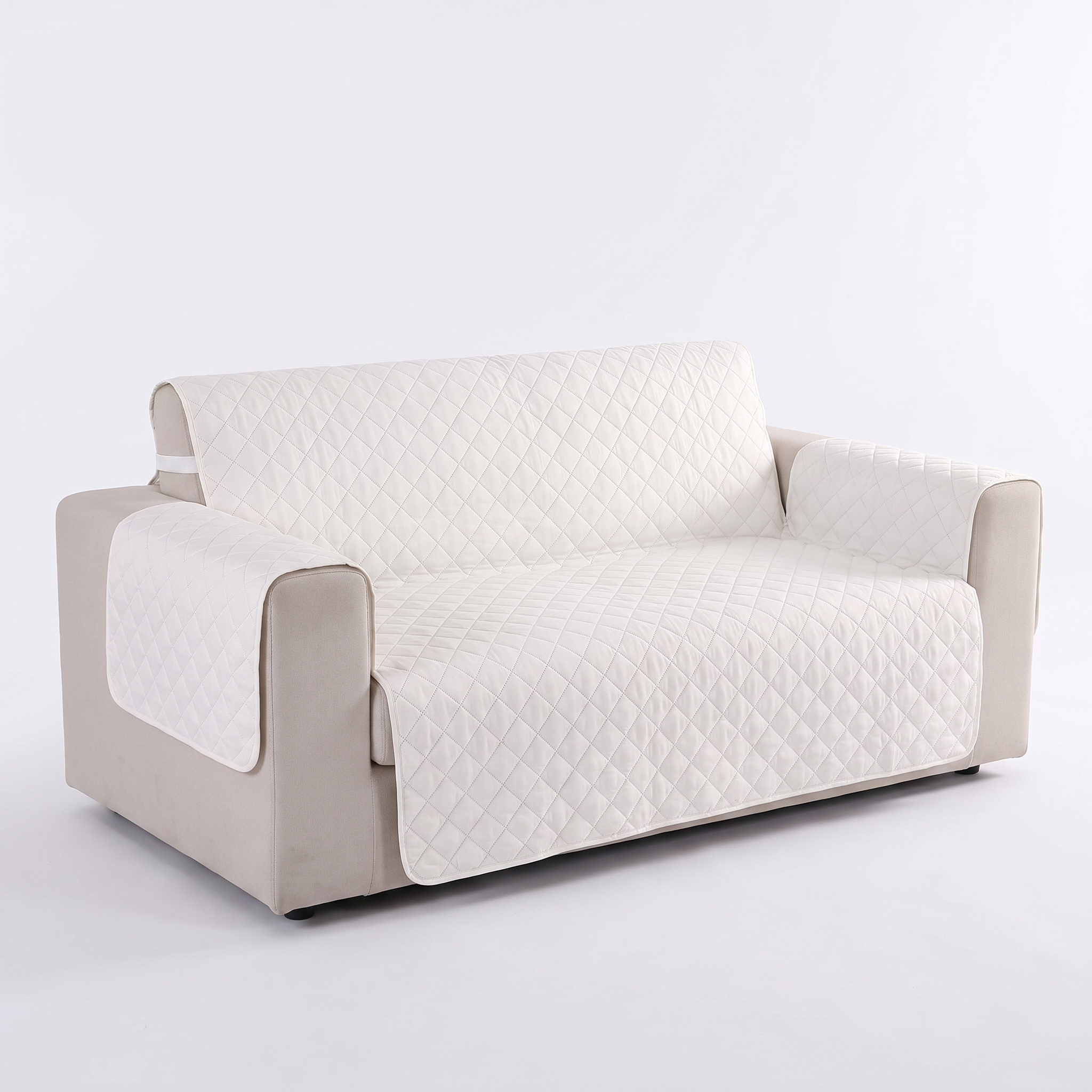 White quilted waterproof sofa protector cover, studio shot