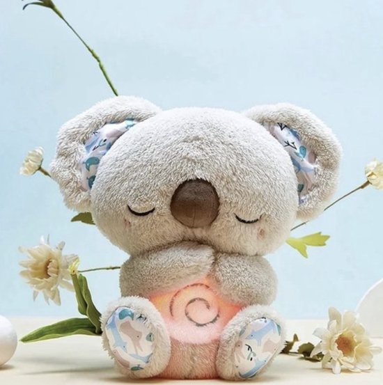 A breathing plush toy sleep aid with a soft fabric exterior, showing the rhythmic breathing belly mechanism.