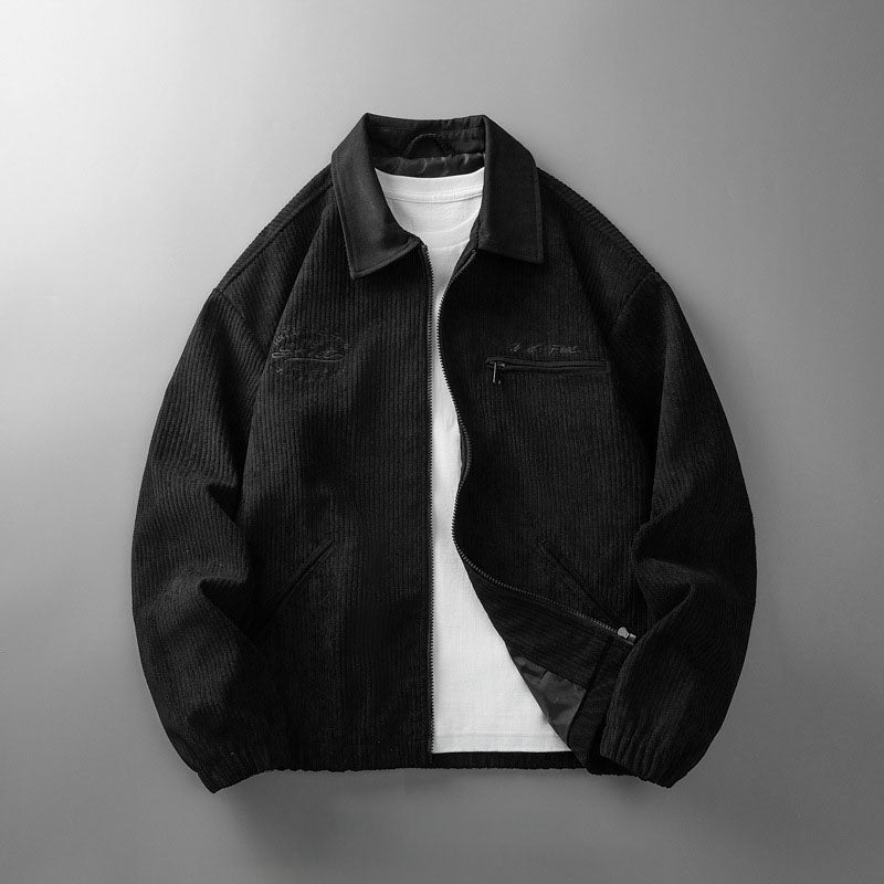 Man wearing a corduroy jacket with a stand collar and elastic hem