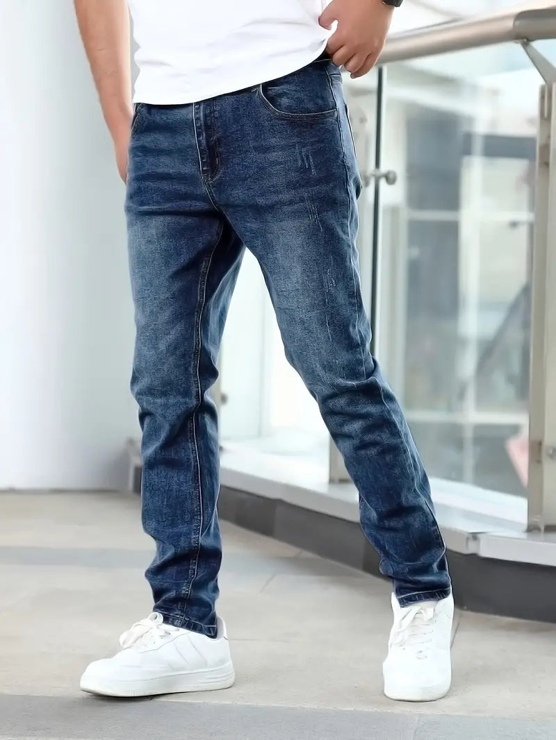 Man wearing straight fit jeans with a light worn wash