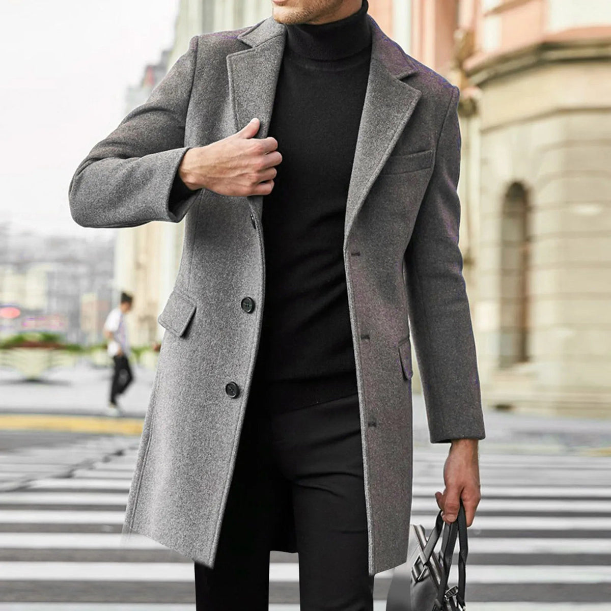 Detail of the flap pocket and buttons on a men's long coat