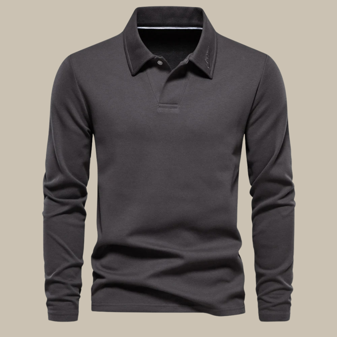 Man wearing a long sleeve polo shirt with a button placket and chinos