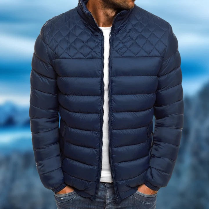 Man wearing a windproof and waterproof quilted jacket outdoors