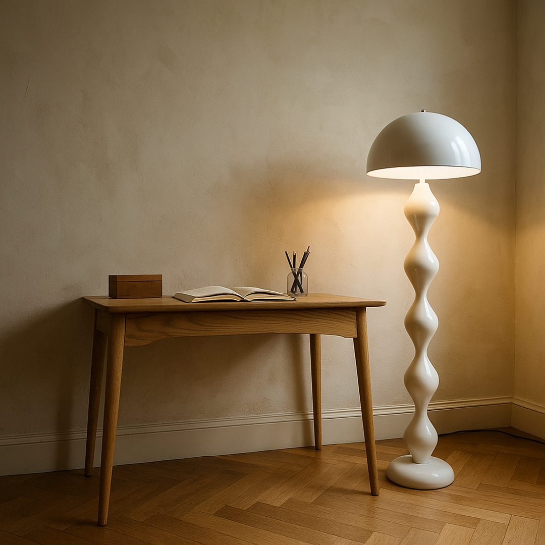 Floor lamp with mushroom shade and wavy turned column next to a sofa