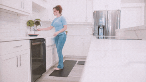 Long non-slip kitchen mat in front of a kitchen counter and sink