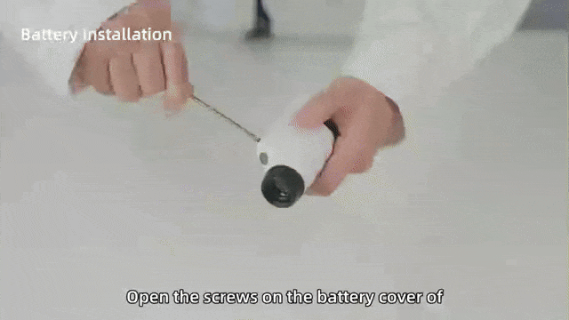 Child looking at a leaf through a handheld pocket microscope